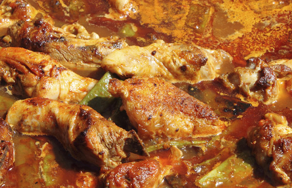 Creole chicken cooking